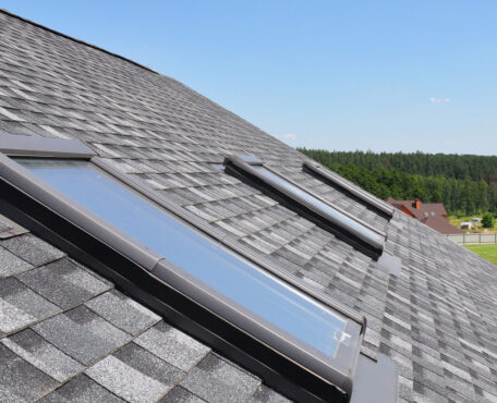 Roof windows and skylights and blue sky Roof windows and skylights and blue sky